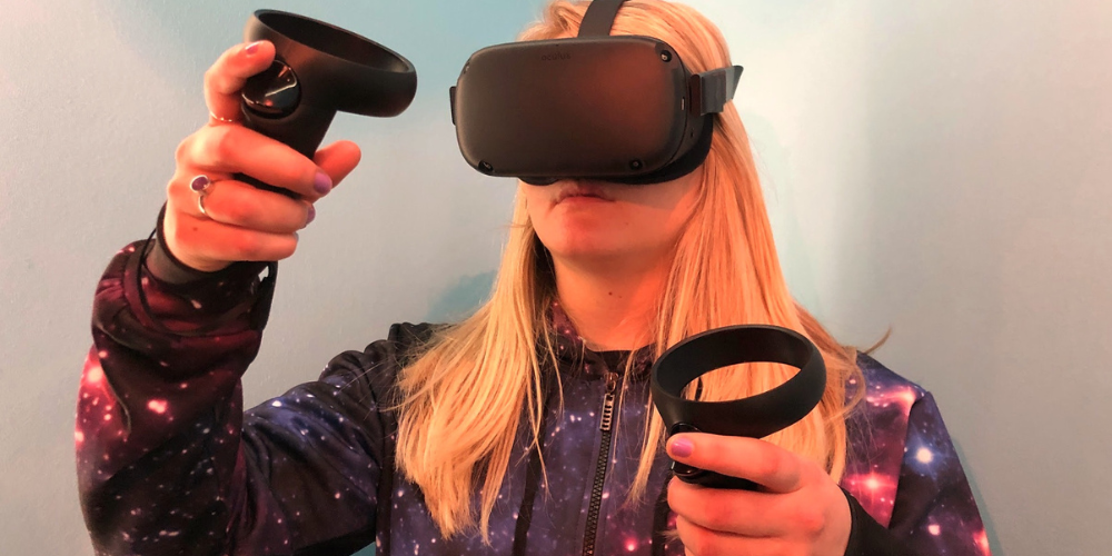 A girl wearing Oculus Quest VR goggles.